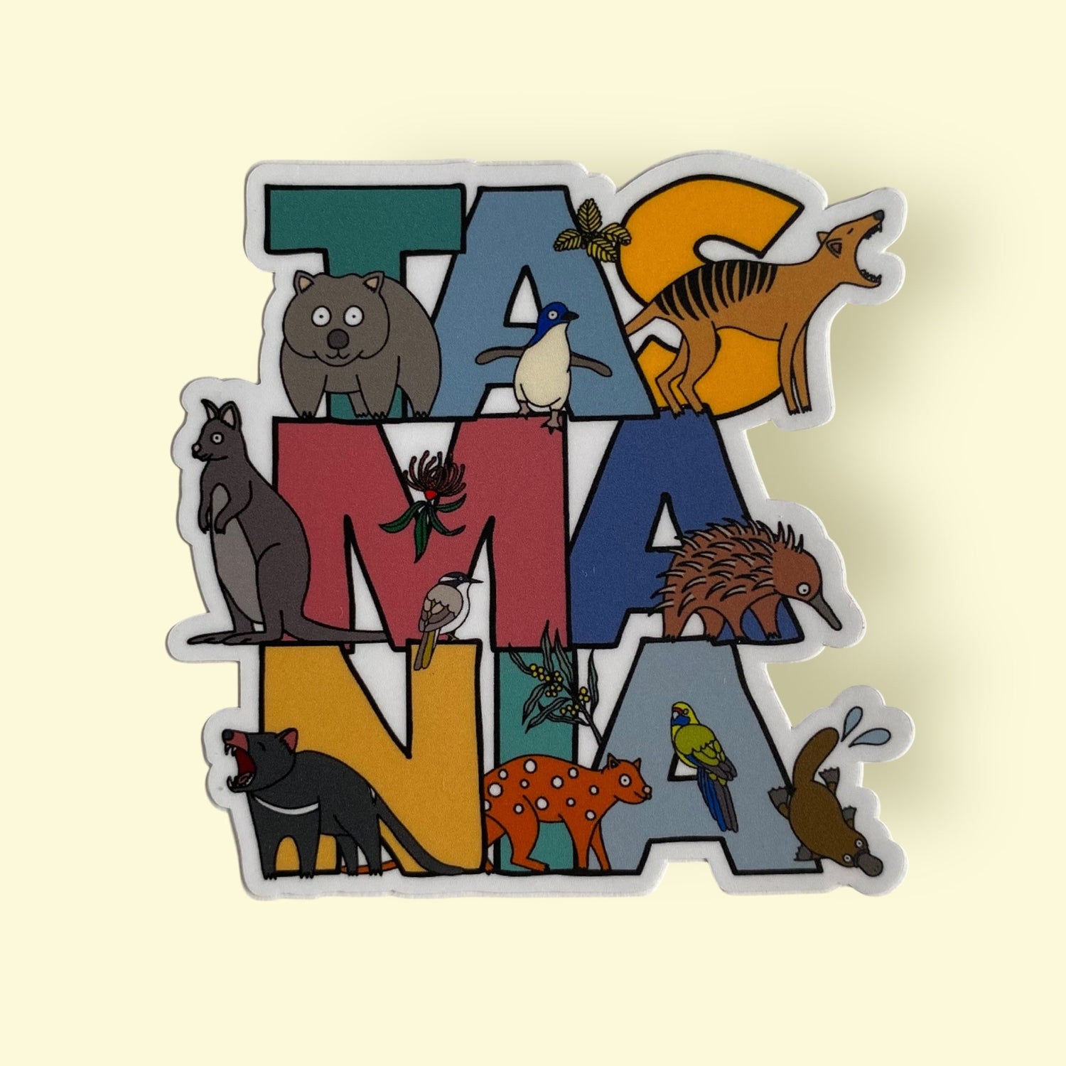 Magnet featuring the word Tasmania in various colours, and Tasmanian Animals, Birds and Flowers